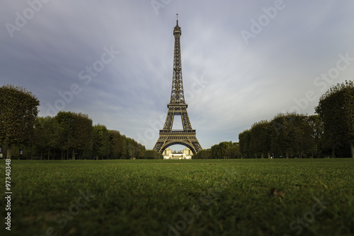 Eiffel tower with greenery foreground in clear sky day