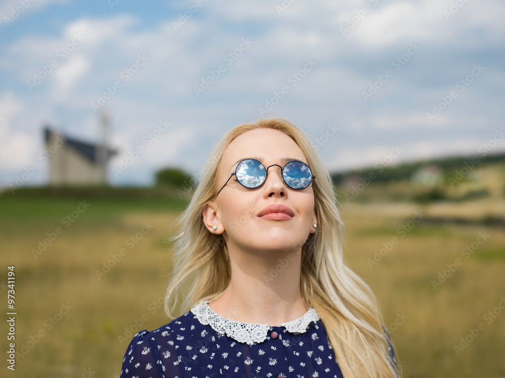 Fashion portrait of young beautiful woman posing in nature Fashion portrait of young beautiful woman posing in nature