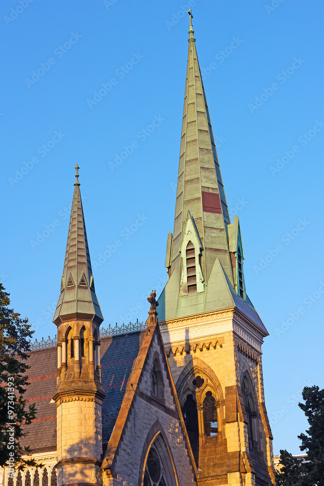 The Church of the Ascension and Saint Agnes in Washington DC, USA. The Gothic Revival brick structure of the historic Episcopal church building in US capital touched by sunset. The Church of the Ascension and Saint Agnes in Washington DC, USA. The Gothic Revival brick structure of the historic Episcopal church building in US capital touched by sunset.