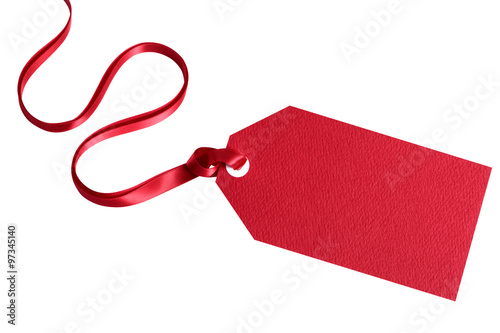 Red gift tag or label tied with red ribbon isolated on white background for christmas or birthday present photo