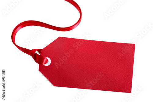 Red gift tag or label tied with red ribbon isolated on white background for christmas or birthday present photo