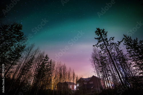 Northern lights aurora borealis in the night sky photo