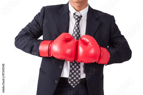 Portrait of businessman with red boxing gloves on white background, Concept about fight © japhoto