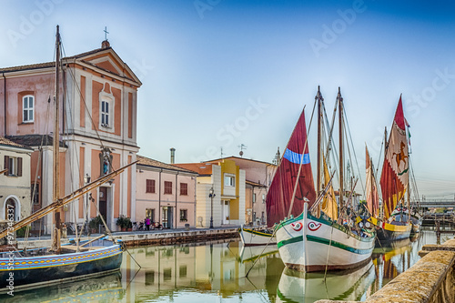 Church and ancient sailboats on Canal Port