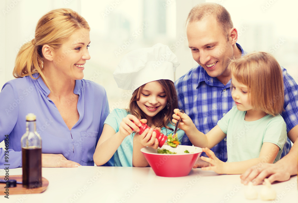 happy family with two kids making dinner at home