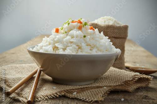 Steamed rice close-up with chopsticks on burlap