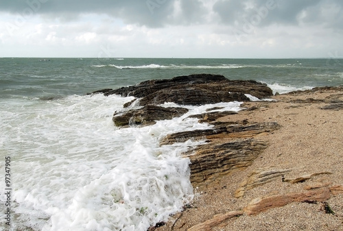 French sea shore with wild waves and rocks