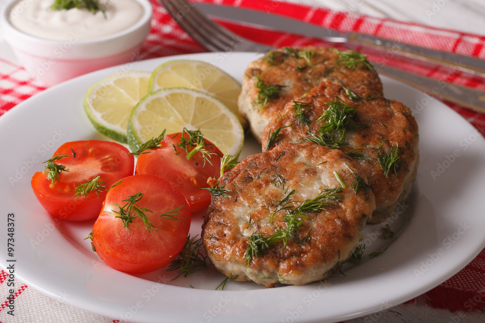 Fish burgers close up on a white plate and sauce. Horizontal
Fish burgers close up on a white plate and sauce. Horizontal