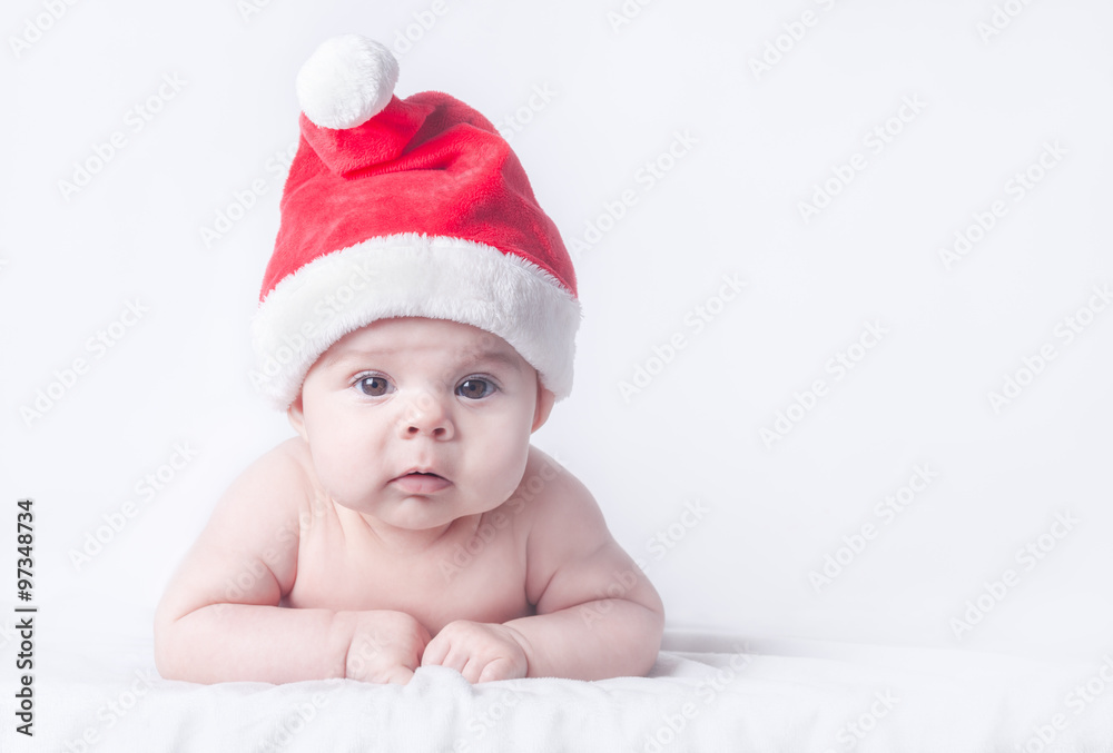 Cute Baby Girl in Red Santa Hat on Clean Wintry Background Cute Baby Girl in Red Santa Hat on Clean Wintry Background