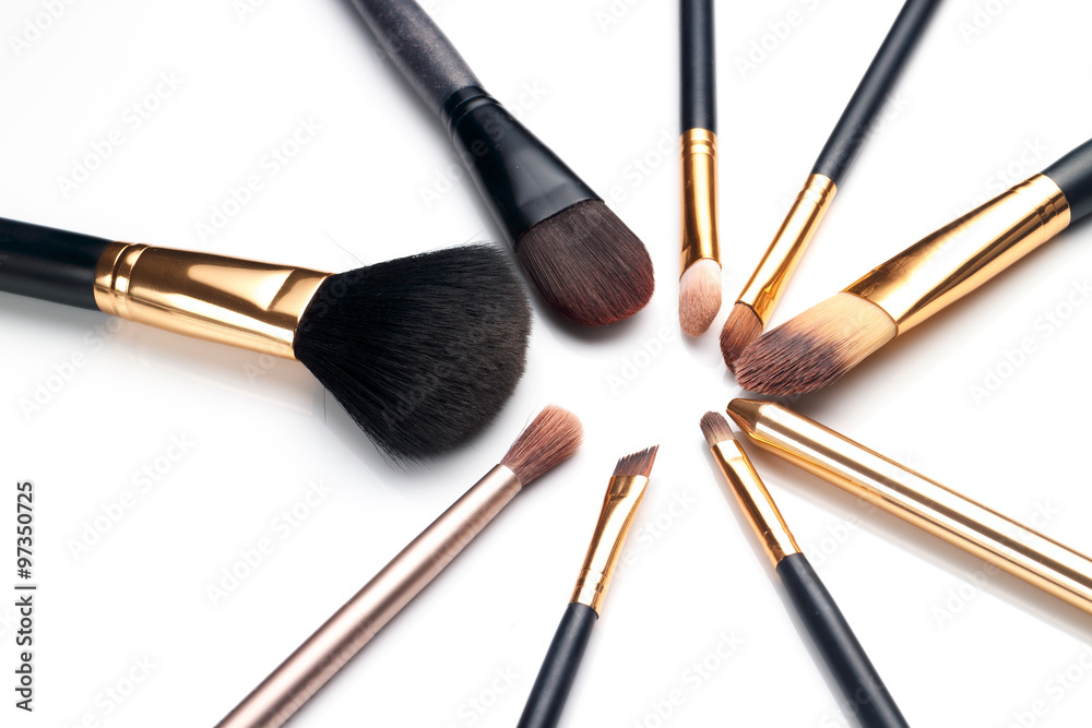 Top view of Brush and cosmetic on white Top view of Brush and cosmetic on white
