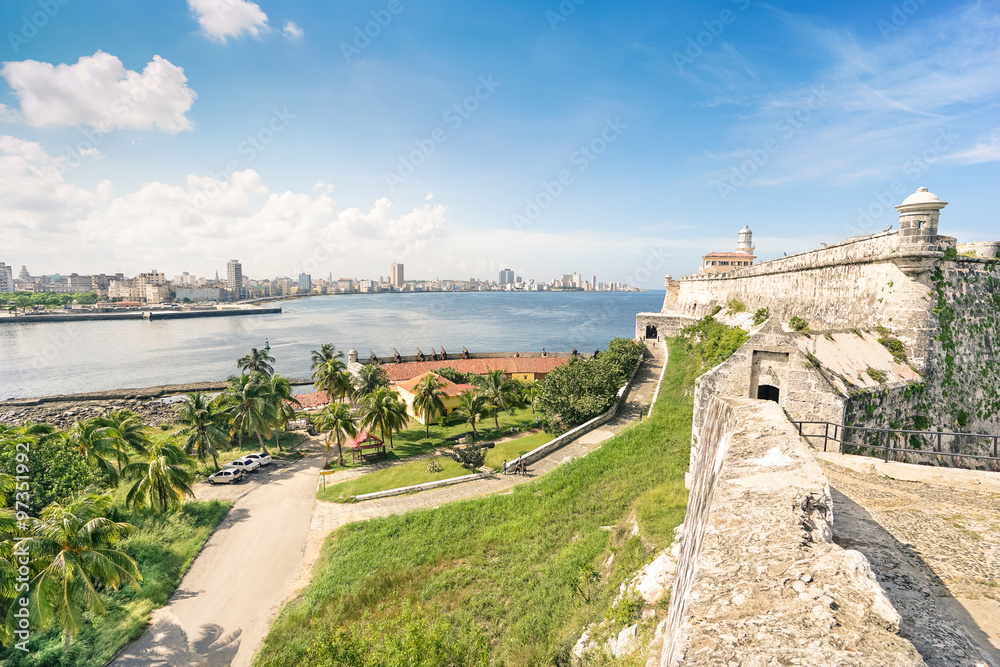 Havana skyline view from the fortress of  " El Morro "on a beautiful sunny day - World famous capital of Cuba in caribbean islands - Travel concept with historical central latin american destination - obrazy, fototapety, plakaty 