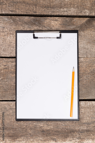 Notebook on wood table for background