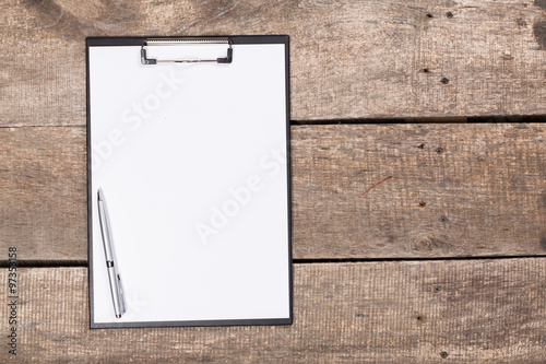 Notebook on wood table for background
