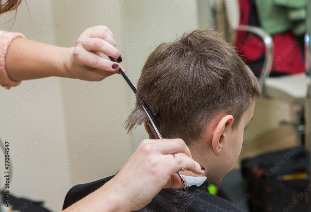 Fototapeta premium boy at barber , haircut