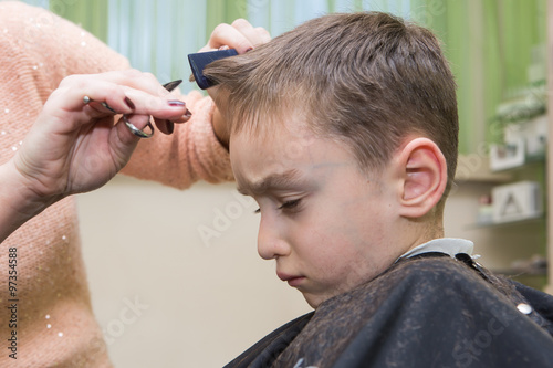 boy at barber , haircut