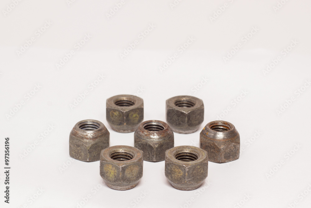 Metal and steel nuts on white background Metal and steel nuts on white background
