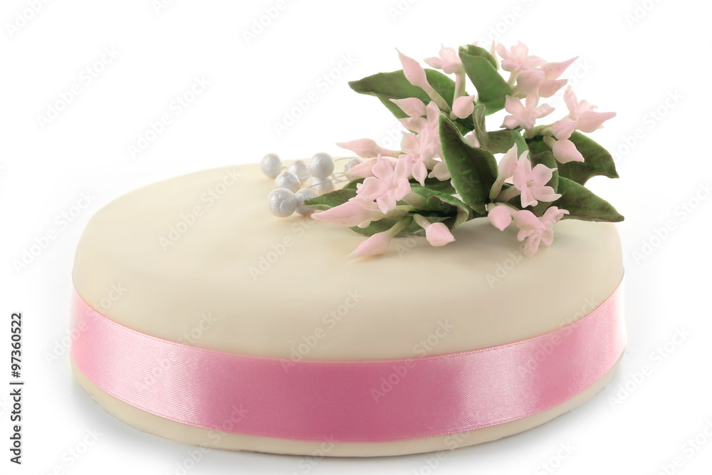 Cake with sugar paste flowers, isolated on white Cake with sugar paste flowers, isolated on white