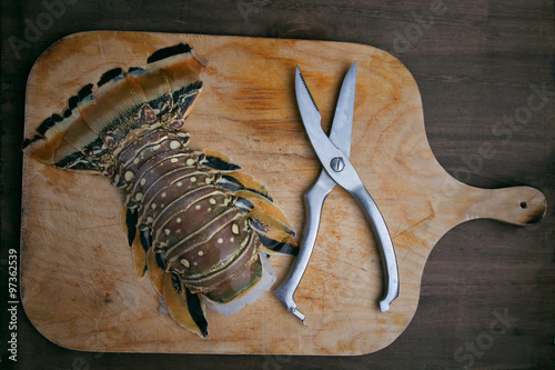 Lobster tail top view with scissors photo