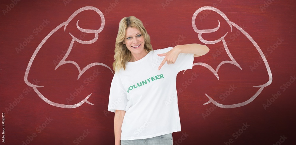 Happy female volunteer pointing tshirt
