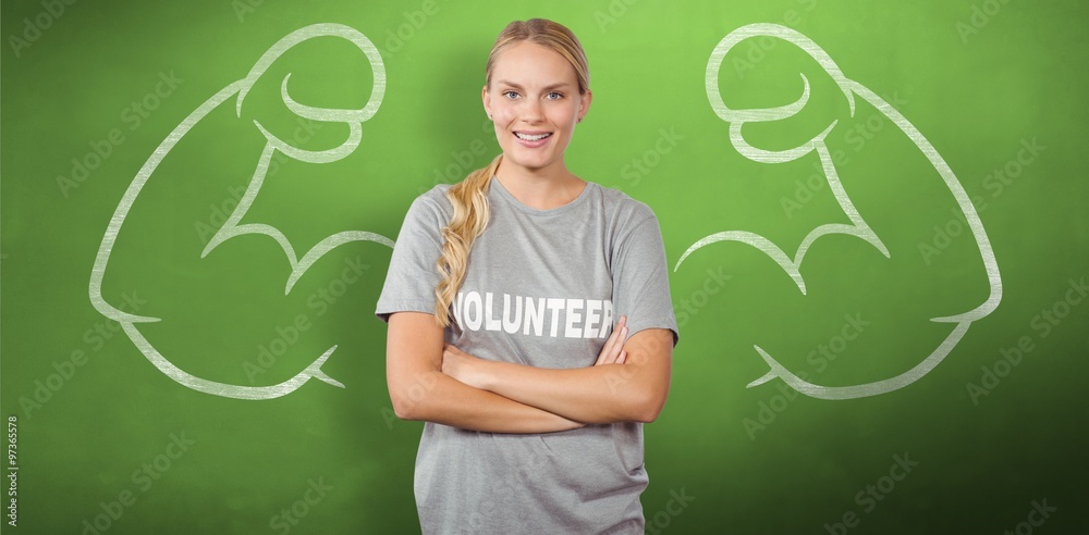 Happy female volunteer with arms crossed