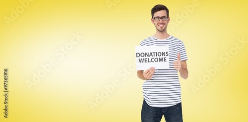 Man holding a donation welcome note