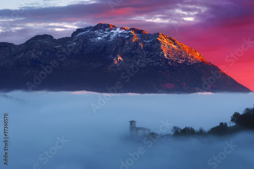 sunrise in Aramaio valley with Udalaitz mountain photo