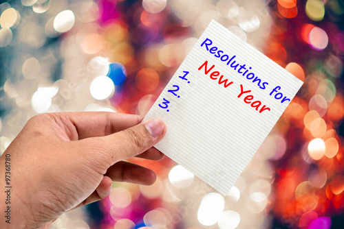 New Year's  Resolution handwriting on a sticky note