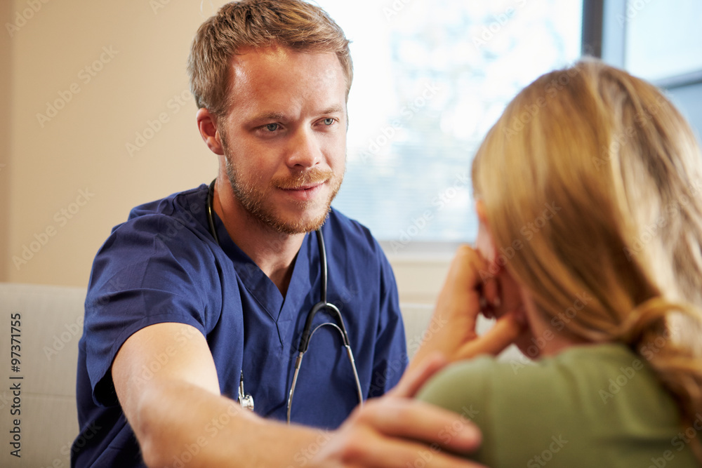 Fototapeta premium Doctor Treating Teenage Girl Suffering With Depression