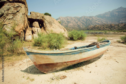 Rural landscape with old fishing boat on the dry land of beach   lake Bafa  rural Turkey.