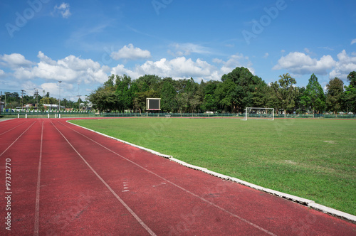 race track , football field with blue sky © thitilim