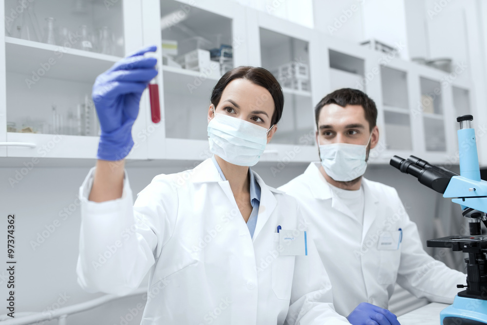 young scientists making test or research in lab young scientists making test or research in lab
