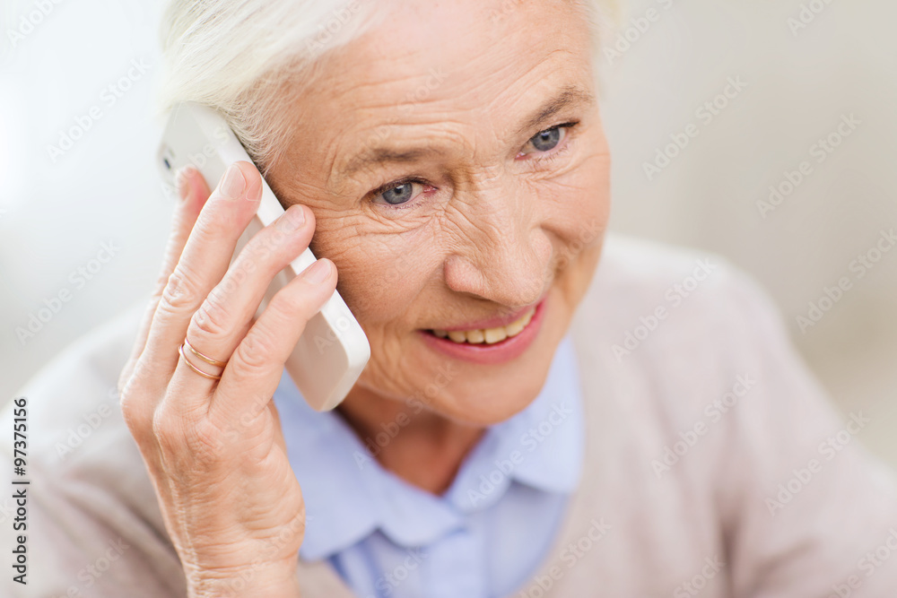 senior woman with smartphone calling at home senior woman with smartphone calling at home