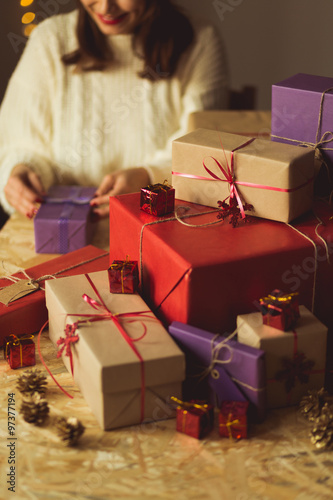 Woman wrapping xmas gift