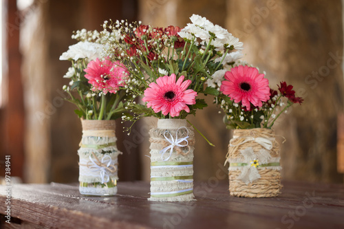 Fototapeta Naklejka Na Ścianę i Meble -  flowers in vases from wood