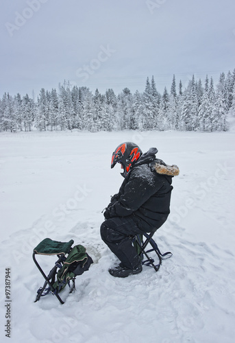 Ice-fishing in Ruka in Lapland