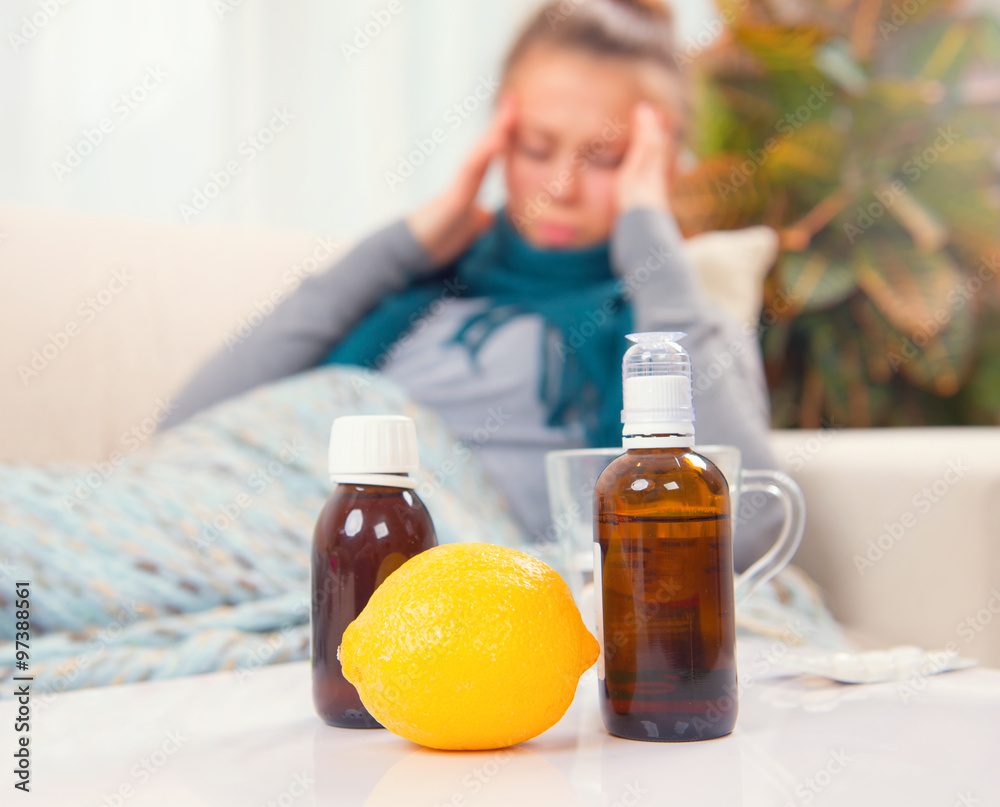 Sick young woman lying on the sofa at home. Flu Sick young woman lying on the sofa at home. Flu