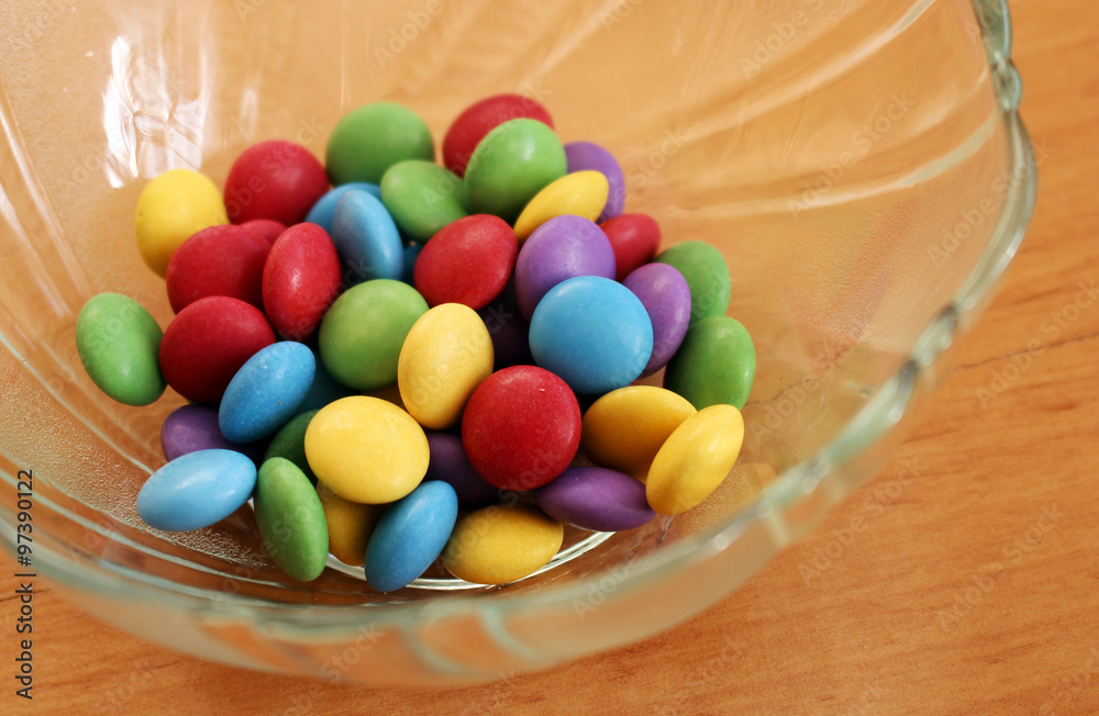 Bowl full of colorful tasty chocolate candies