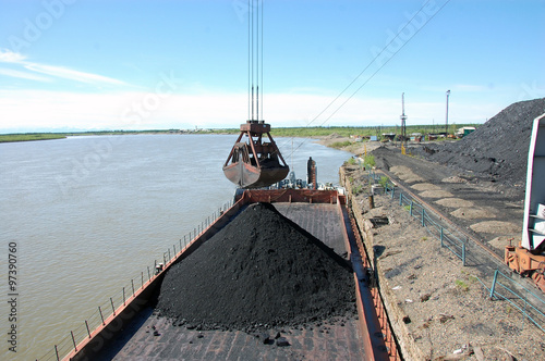 Dockside cargo crane at river port Kolyma