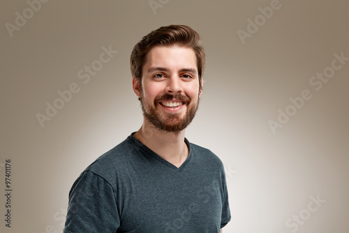 Smiling young man with beard