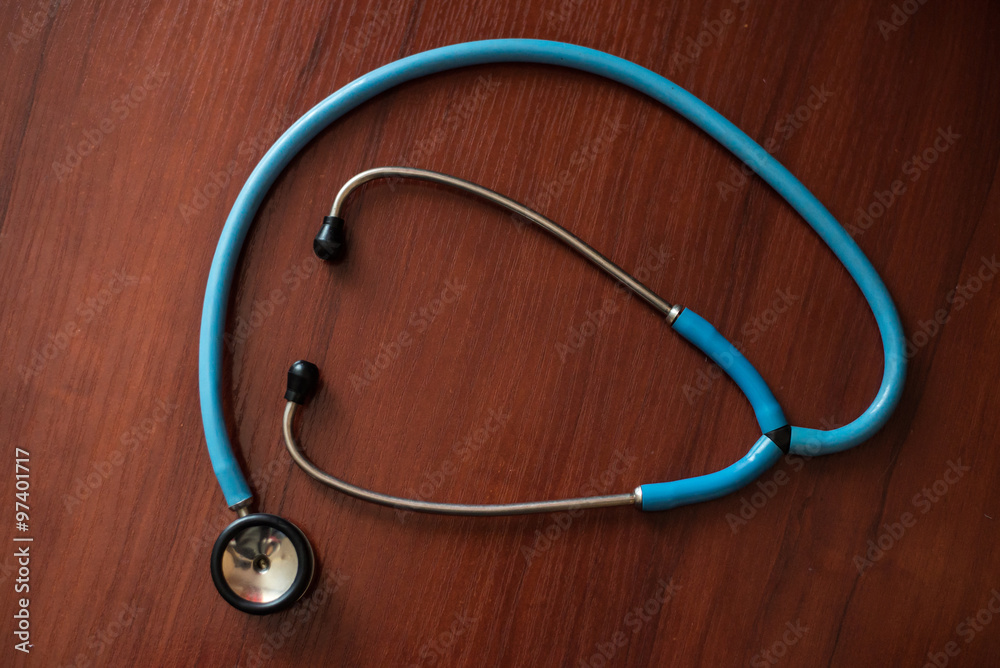 Stethoscope on wooden background Stethoscope on wooden background