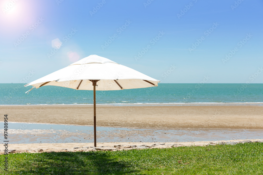 Umbrella On The Beach On Sunny Day