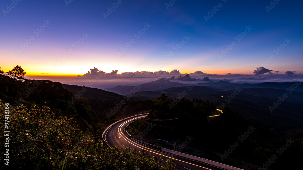 Doi Inthanon National park in the sunrise, mist and main road at
