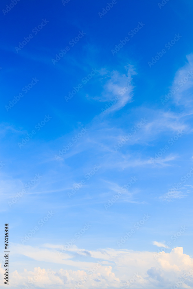 Fototapeta premium Blue sky background with tiny clouds
