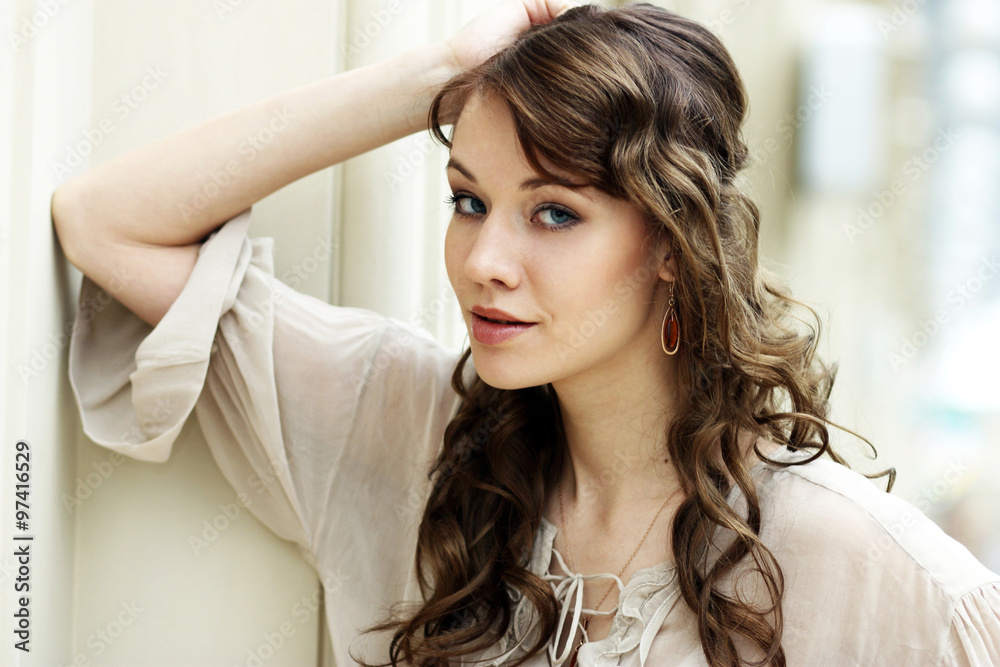 Portrait of beautiful young happy woman in disco grey dress Portrait of beautiful young happy woman in disco grey dress