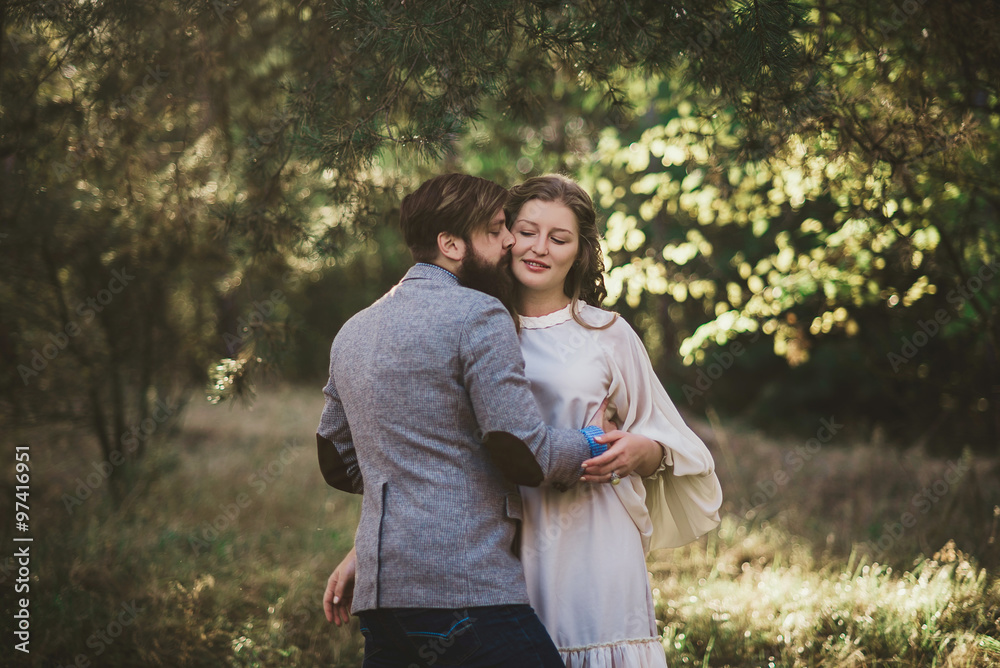 beard man and nice woman kiss
