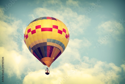 Hot air balloon on sky with cloud, vintage color effect © jakkapan