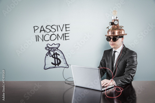 Passive income concept with vintage businessman and laptop