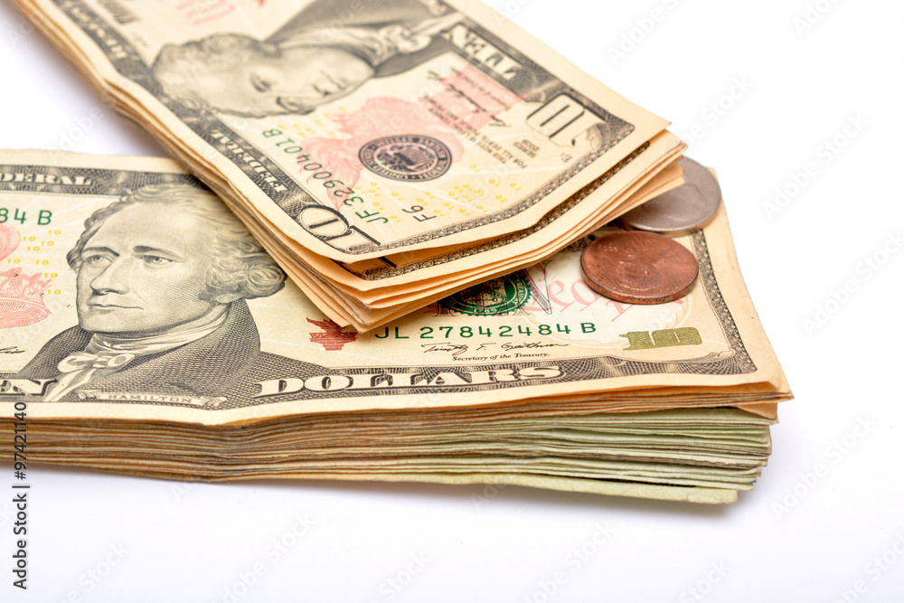 Currency notes dollars and coins on white background. Currency notes dollars and coins on white background.