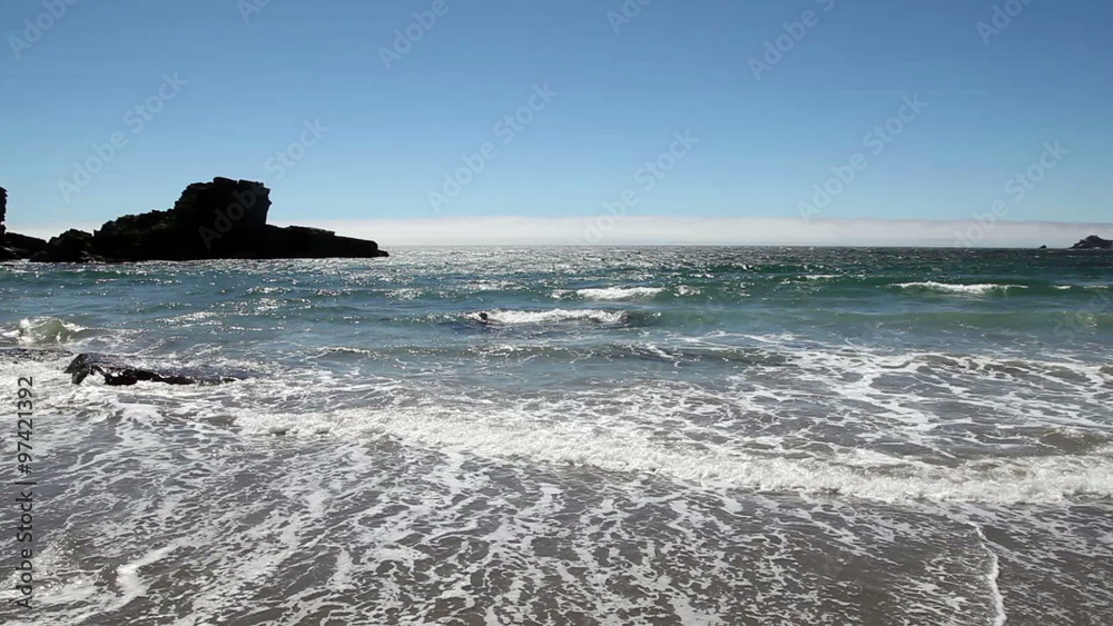 Waves Filling Frame On Sandy Beach With Rocks
Waves Filling Frame On Sandy Beach With Rocks