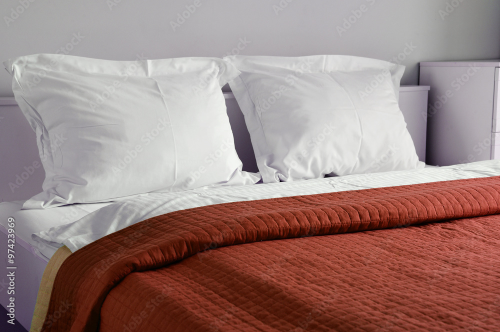 Obraz premium Double bed in hotel room. Accommodation